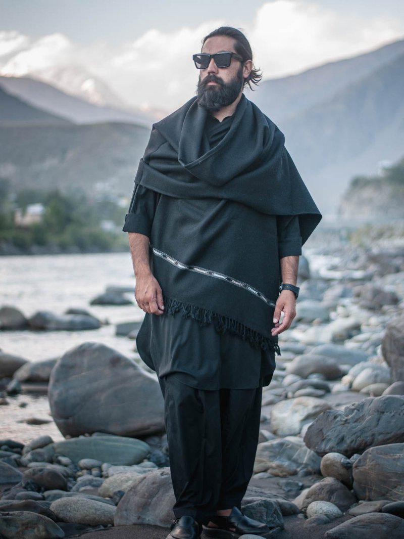 model wearing handwoven black premium shawl outdoors